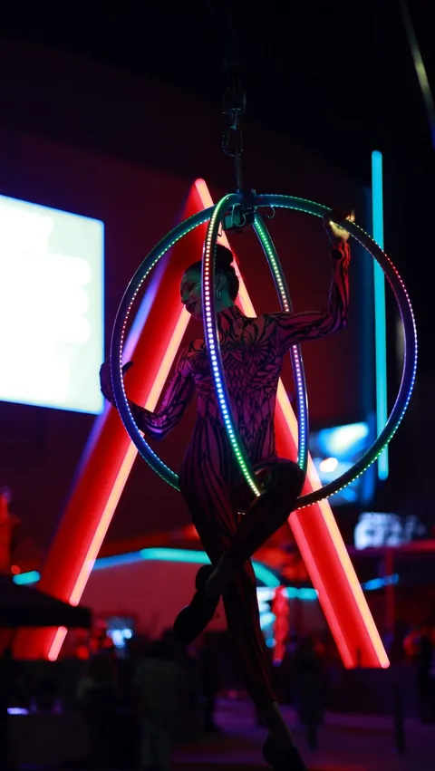Programmable LED hoops performed on an aerial lyra