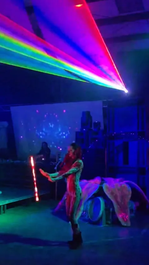 LED prop performance inside a laser show