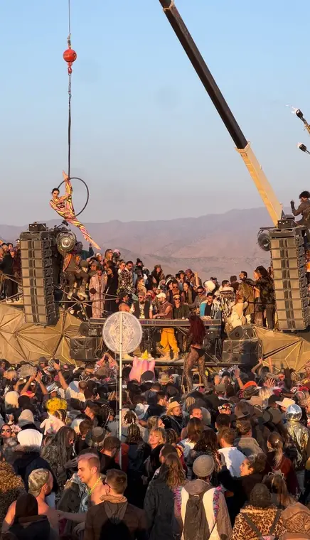Aerial hoop suspended above the Burning Man crowd on the Maxa art car