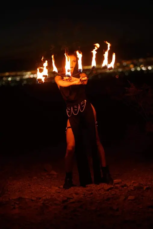 Fire fans performed against a city backdrop