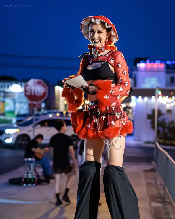 Handing out flyers while stilt walking