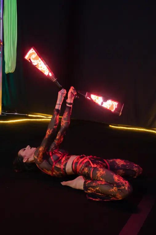 LED poi buzzsaw in a backbend