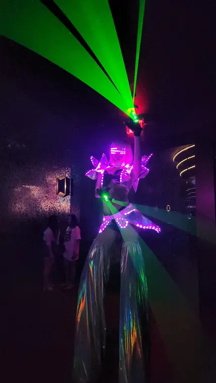 LED stilt dancer with lasers