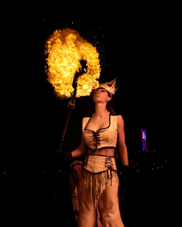 Fire breathing while on stilts at Burning Man