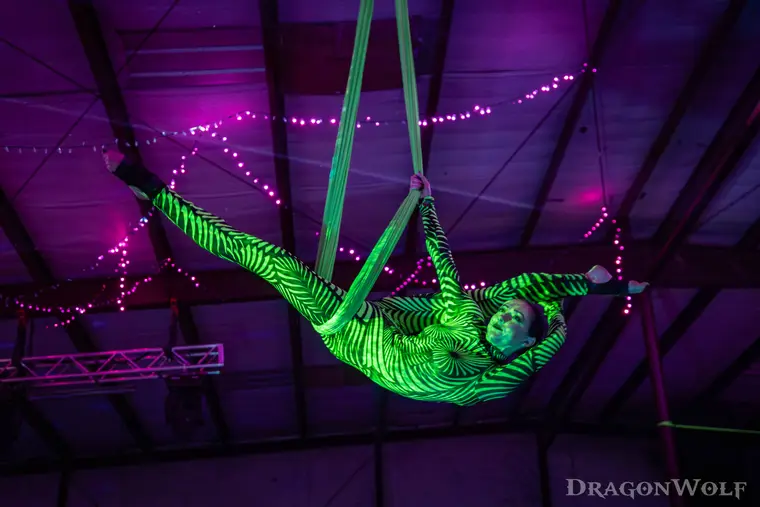 Neon green aerial hammock under UV light